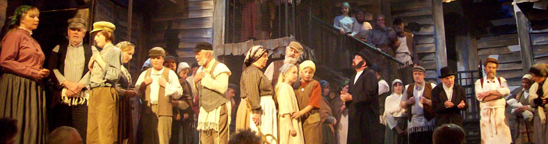 People on stage in past performance